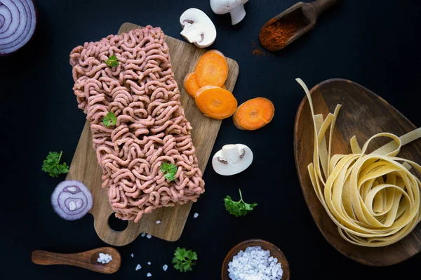 Ingredients for pasta bolognese, plant-based meat minced from vegetables and mushrooms.