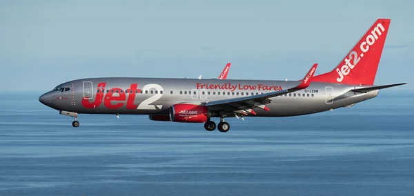 stock image Tenerife, Spain June 4st, 2023. Boeing 737 of Jet2 Airlines flies in the blue sky over the ocean