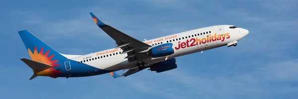 Stock image Tenerife, Spain June 7st, 2023. Boeing 737-800 of Jet2 Airlines flies in the blue sky. Jet 2 is a British Low cost airline