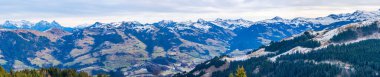Panoramic aerial view of Alps and countryside surrounding Kitzbuhel in Austria