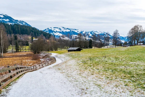 Wintry landscape with view of Alps near Schwarzsee lake in Kitzbuhel. Winter in Austria