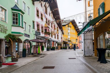 KITZBUHEL, AUSTRIA - JANUARY 11, 2023: Street view in Kitzbuhel, a small Alpine town. Upscale shops and cafes line the streets of its medieval center.