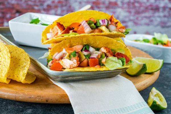 Grilled salmon tacos with avocado salsa