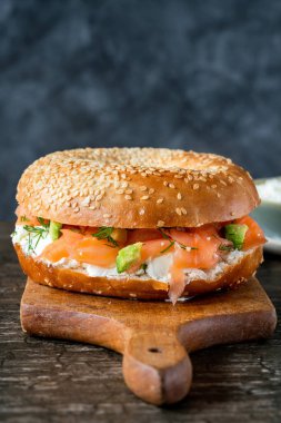 Sesame bagel with cream cheese and smoked salmon