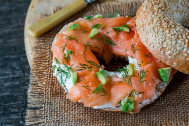 Sesame bagel with cream cheese and smoked salmon