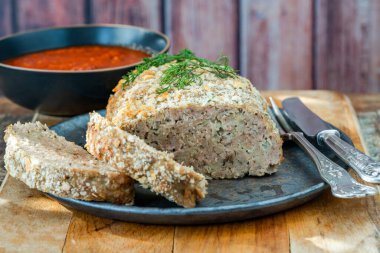 Homemade pork meatloaf with tomato sauce