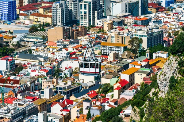 stock image Cable car going up the Gibraltar Rock with Gibraltar town in the background, UK