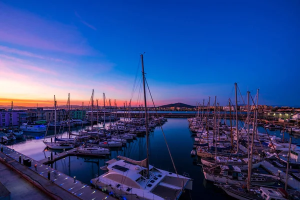 stock image Colorful sunset over the Marina Bay in Gibraltar, a British Overseas Territory. UK