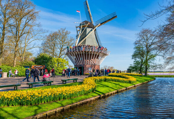 KEUKENHOF, HOLLAND - APRIL 19, 2023: Keukenhof situated in the municipality of Lisse, also known as the Garden of Europe, is one of the world's largest flower gardens and a popular tourist site