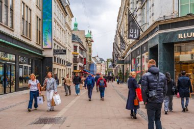 COPENHAGEN, DENMARK - APRIL 16, 2024: Stroget shopping district is the longest pedestrian, car-free shopping area in Europe and one of the most high-profile streets in Copenhagen. clipart