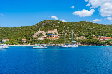 Crystal clear waters of Adriatic Sea around Elaphiti Island Sipan near Dubrovnik. Summer in Croatia clipart