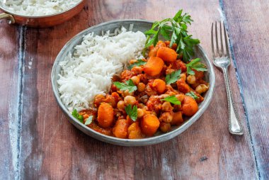 Chickpea and carrot tagine with rice clipart