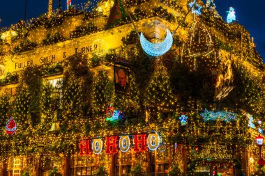 LONDON - DECEBMER 14, 2024: London's most iconic, historic pub Churchill Arms in Kensington is decorated for Christmas. Managed by Fuller's it is known for serving real ales and authentic Thai cuisine clipart