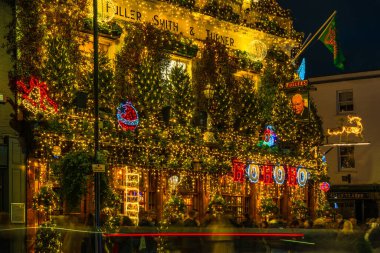 LONDON - DECEBMER 14, 2024: London's most iconic, historic pub Churchill Arms in Kensington is decorated for Christmas. Managed by Fuller's it is known for serving real ales and authentic Thai cuisine clipart