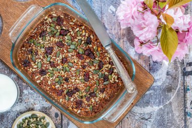 Healthy home baked rolled oats, pumpkin and sunflower seeds breakfast cake