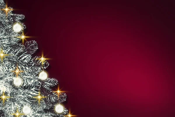Merry Christmas background with white fir tree isolated on red.