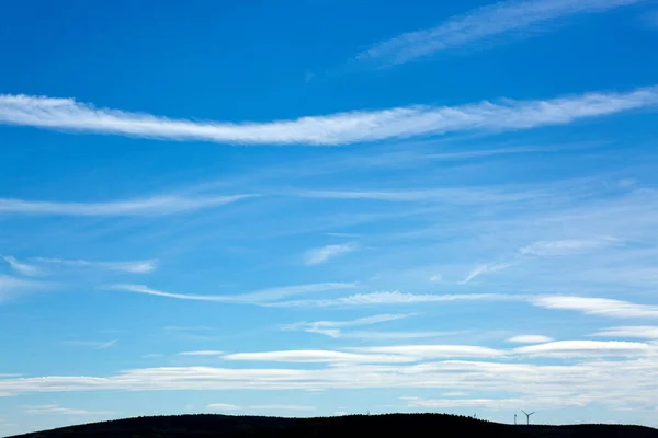 Stock image Blue sky background with tiny clouds