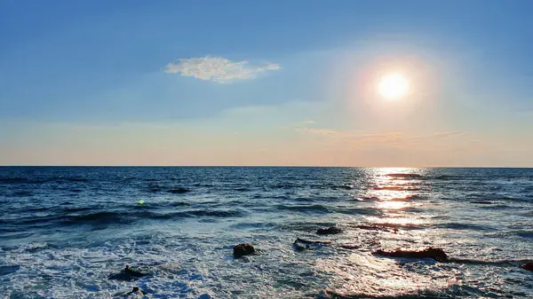Sea with sunset sky and sun .Horizon over the water.