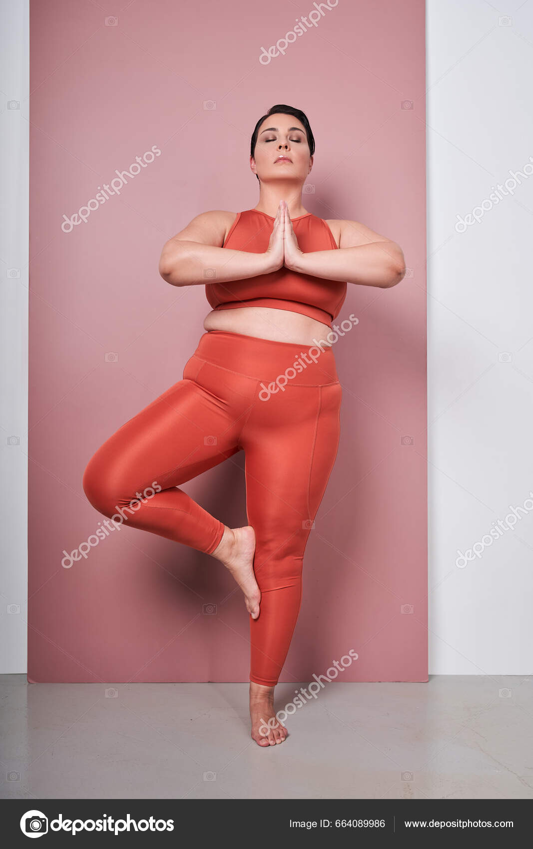 Vertical View Body Positive Woman Training Yoga Meditating Connected Hands  Stock Photo by ©iakovenko123 664089986