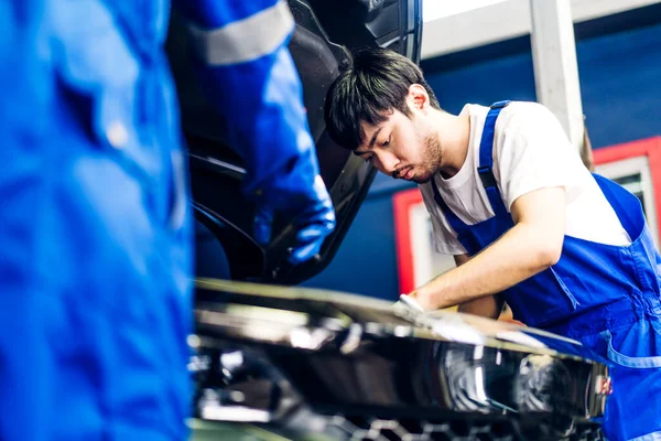 Professional Car Technician Mechanic Team Uniform Work Fixing Vehicle Car Royalty Free Stock Images