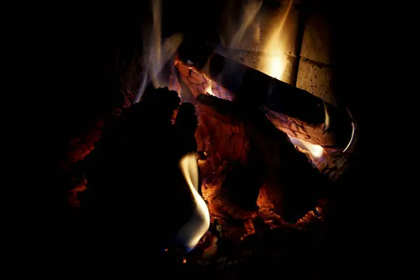 Burning wood inside a fireplace