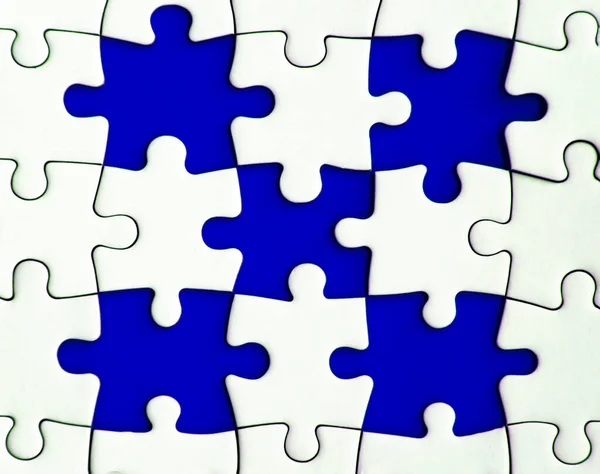 Missing jigsaw puzzle on blue background with customizable space for text or ideas. Copy space.