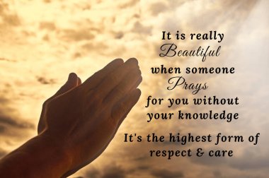 Prayer to someone text with hand praying on vintage color background. Spiritual and motivational concept.