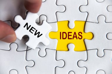 New ideas text on missing jigsaw puzzle. Business idea concept.
