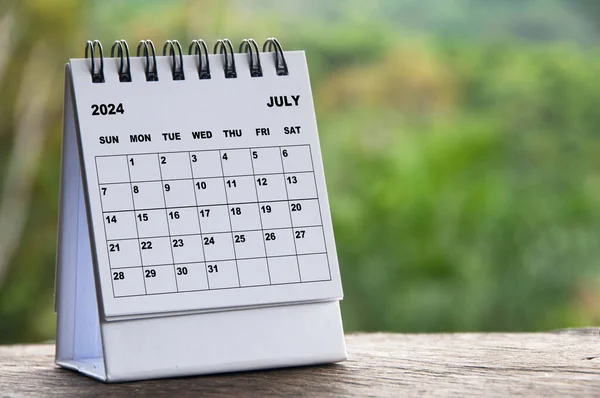 stock image 2024 July month calendar with blurred nature background. Copy space and calendar concept.