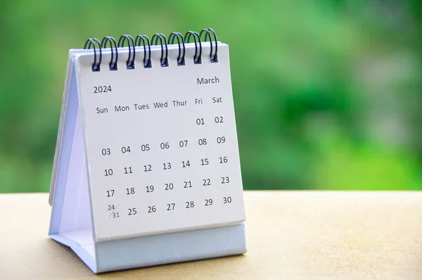 stock image March 2024 white table calendar with customizable space for text. Copy space