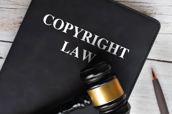 Copyright Law book with gavel background. Law concept.