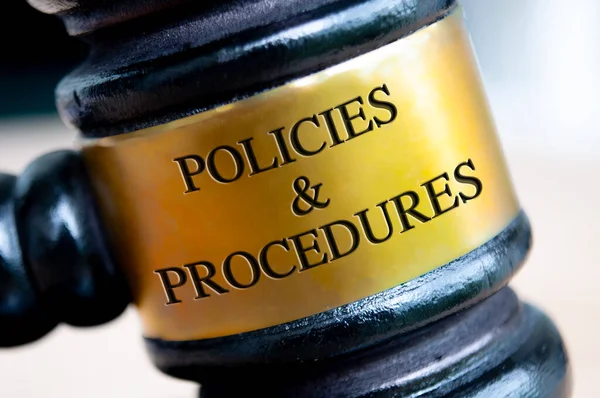 Policies and Procedures text engraved on gavel. Policies and procedures concepts.
