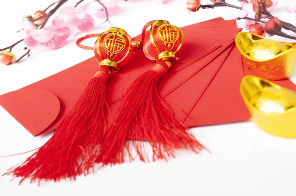 Chinese New Year red packet and golden ingot. Chinese New Year celebration concept.