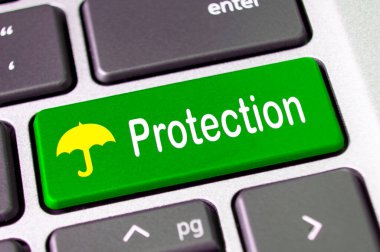 Yeşil klavyede şemsiye sembollü koruma metni.