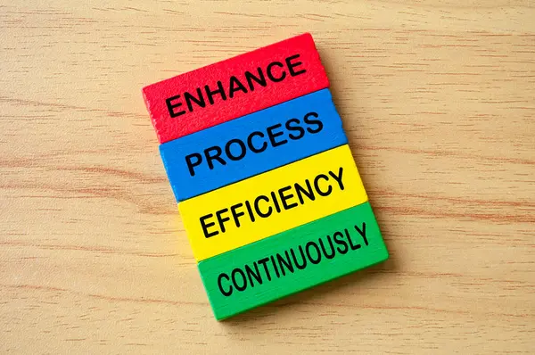 Stock image Top view of Enhance Process Efficiency Continuously text on multicolored wooden blocks. Business improvement concept.