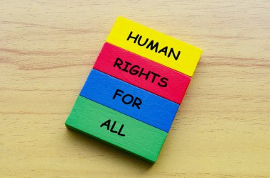 Top view of Human Rights For All text on multicolored wooden blocks. Against discrimination concept. clipart