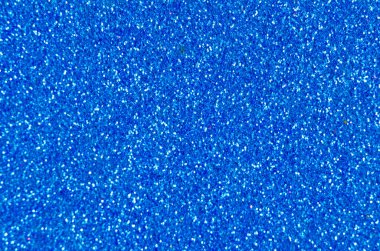 Bir okyanusun mavi parıltısını ya da ışıltılı dokusunu kapatın ve tasarımlar için arka plan ya da duvar kağıdı olarak kullanılabilir.