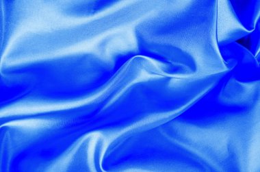 Açık mavi renkli ipekten yumuşak, pürüzsüz dalgalar ve parlak bir son. Tasarım ve duvar kağıdı arkaplanı için uygun.