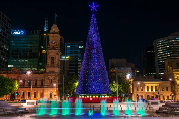 stock image Adelaide, Australia - January 2, 2022: Big Christmas Tree installed at Victoria Square in Adelaide CBD while illuminated at night time.