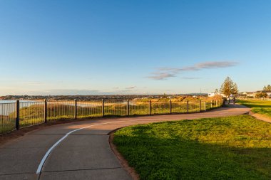 South Port shared footpath and biketrack viewed towards the  Onkaparinga River at sunset, South Australia