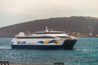 Penneshaw, South Australia - January 17, 2019: Last for the day Sealink ferry arriving at Penneshaw Sealink terminal from the Australia mainland at dusk