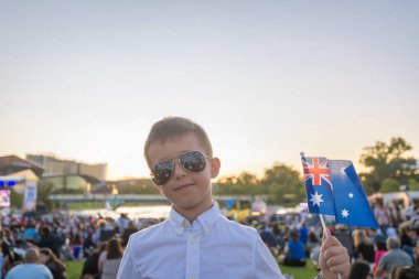 Two Australian kids watching  Australia Day Celebration concert in Adelaide city