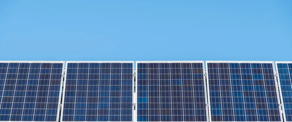Solar panels on Australian house on a bright sunny day against blue sky