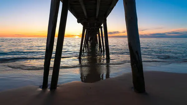 stock image Under Port Noarlunga jetty view from the shore at sunset, South Australia