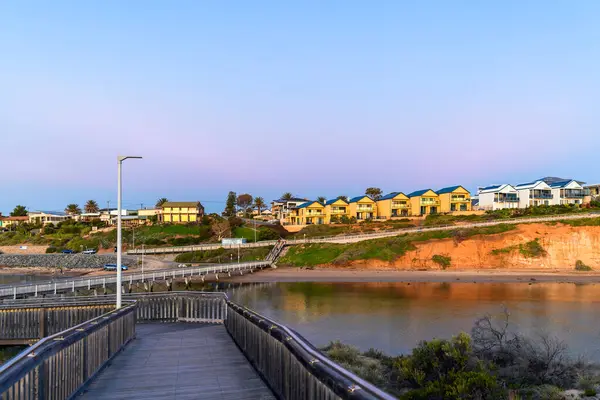 stock image Southport boardwalk towards the surf life saving club across the Onkaparinga river at sunset