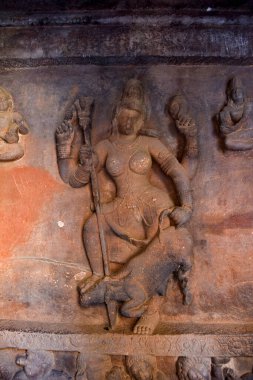 Sculpture of Goddess Durga or Mahishasuramardini slaying the buffalo-demon Mahishasura in cave 1 of the Badami caves complex in Karnataka in India