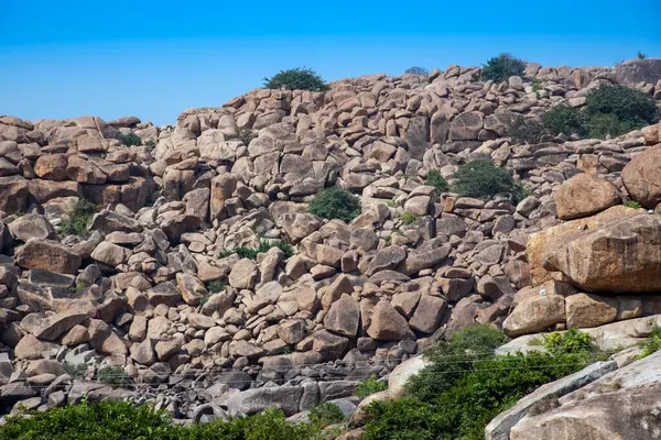 stock image Boulder strewn landscape of Hampi which is a UNESCO Heritage Site. Hampi was the capital of the Vijayanagar Empire.