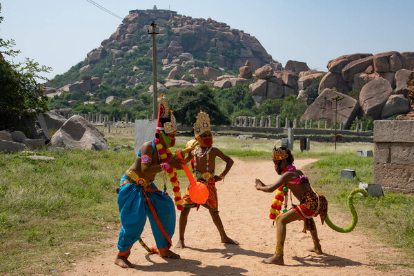 Hampi, Karnataka, India - Oct 31 2022: Children enacting scenes form the Hindu epic Ramayana at Hampi. Anjeneri Anjanadri near Hampi is believed to be the birthplace for Lord Hanumana