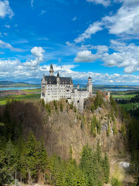 Neuschwanstein Castle is a 19th-century historicist palace on a rugged hill of the foothills of the Alps in the very south of Germany