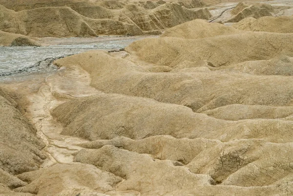 Stock image cracks and dry ditches remains in an arid landscape environmental disaster drought concept